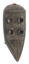 A Grebo (Kru) four eyed warriors spiritual Maou mask with moveable jaw, Liberia, approximately 60-70