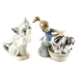 A Lladro porcelain figure group modelled as a young girl washing dog in bathtub, printed marks, 12cm