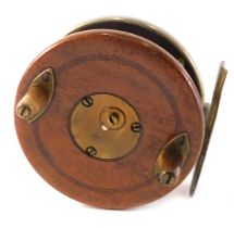 A D Slater's Patent 3945 mahogany brass fishing reel, 8cm diameter.