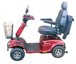 A Pioneer mobility scooter, in dark red livery, with charger, etc.