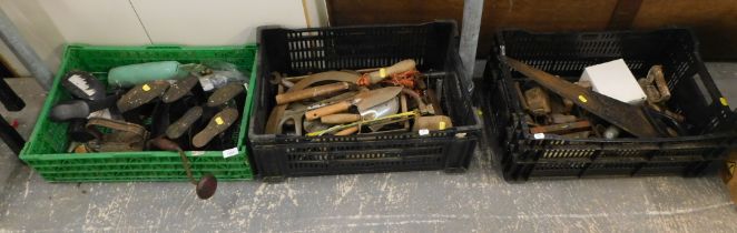 Various hand and garden tools, cast metal irons, spirit levels, mallet, garden forks, etc. (3 crates
