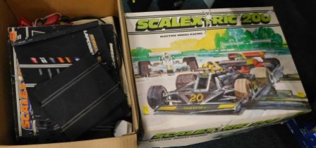 A Scalextric 200 set, boxed, together with a quantity of track.