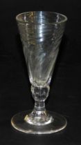 A Georgian wrythen fluted dwarf ale glass, raised on a knopped and waisted stem, over a conical foot