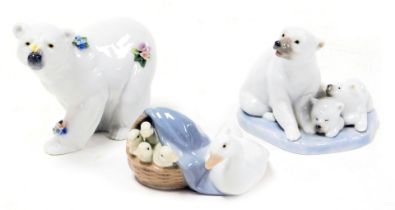 A Lladro porcelain figure of a polar bear, with a butterfly on its snout, and encrusted with flowers