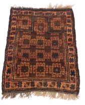 A Baluch red ground prayer rug, the mihrab filled with geometric style flower heads within a repeati