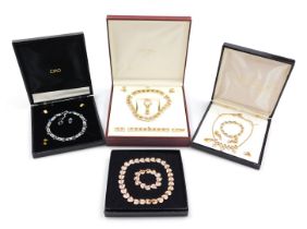 A Rotary parure of costume jewellery, gold plated and paste set, comprising a collar necklace, brace