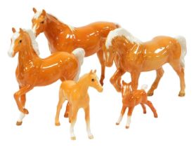 Five Beswick pottery Palomino horses and foals, printed marks.