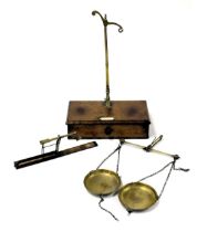 A set of Victorian Avery balance scales, on a mahogany box base, 28cm wide together with brass sover