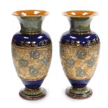 A pair of Royal Doulton stoneware vases, of baluster form, chine decorated with honeysuckle, within