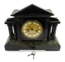 A late 19thC ebonised faux marble mantle clock, circular brass dial with chapter ring bearing Roman