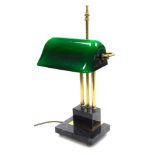 A Catalaina Lighting Ltd brass desk lamp, with a green glass shade, raised on a stepped grey marble