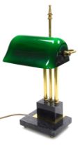 A Catalaina Lighting Ltd brass desk lamp, with a green glass shade, raised on a stepped grey marble