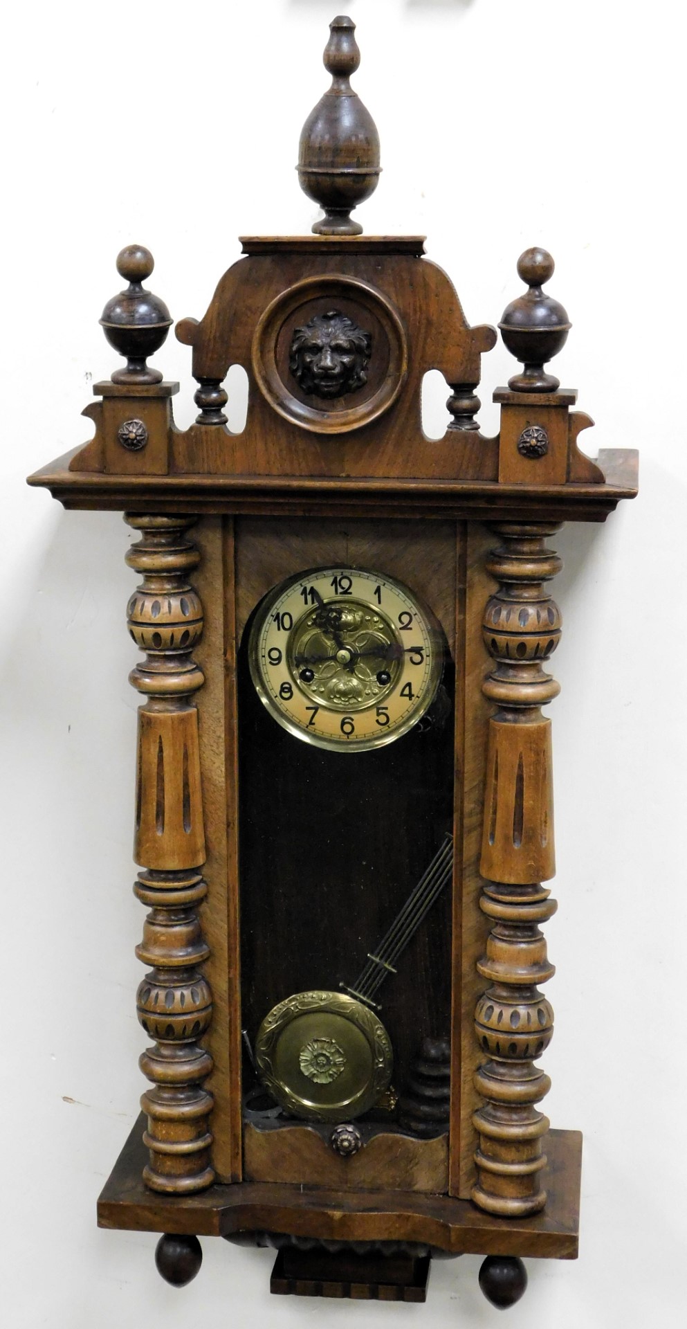 A late 19thC Vienna mahogany cased wall clock, circular brass dial embossed with flowers, chapter ri