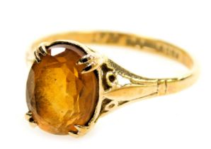 A 9ct gold ring set with a brilliant cut oval citrine, in a claw setting, 1.86g all in.