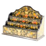 An early 20thC Indian Kashmiri papier mache letter rack, of three tier graduated form, decorated wit