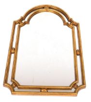 A Regency style gilt wood and gesso wall mirror, with a domed top, 107cm high, 68cm wide.
