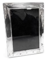 An Elizabeth II silver backed strut photograph frame, Sheffield hallmarks, 18.5cm x 13.5cm.