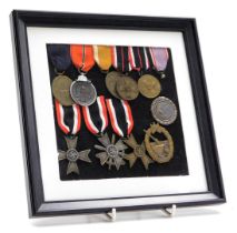 A group of German Third Reich medals, including two War Merit Crosses, Eastern Front metal, Naval A