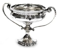 A George V golfing trophy, of twin handled lobed form, engraved Notts Golf Club, Bogey Challenge Cup