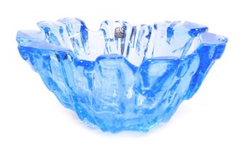 A late 20thC Mats Jonasson blue glass bowl, of abstract, ice formation form, marked to base Mats Jon