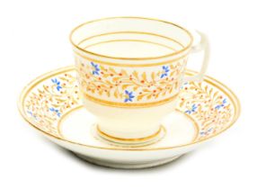 An early 19thC Swansea porcelain coffee cup and saucer, with a duck-egg body, painted and gilded wit