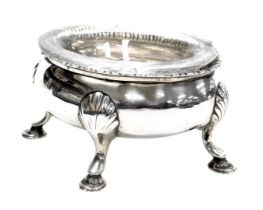 A George III silver oval salt, with a clear glass liner, raised on four hoof feet, Robert Hennell I,