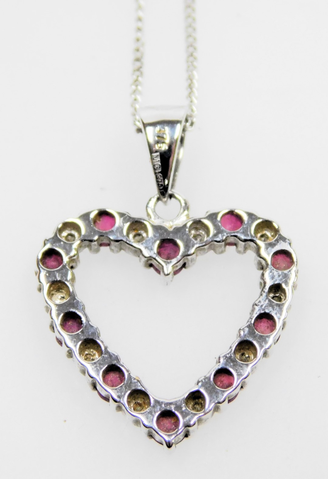 A 9ct white gold ruby and diamond heart shaped pendant, on a ring suspension, and fine curb link nec - Image 2 of 2