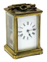 A brass carriage clock, rectangular enamel dial bearing Roman numerals, single barrel movement, the