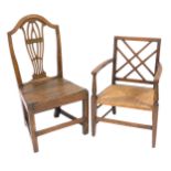 A George III oak country chair, with a carved vase shaped splat, solid seat, raised on square legs u