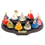 A set of ten Royal Doulton miniature ladies figures, boxed, with stand, and a further figure modell