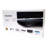A Sony home theatre system, HT-XT3 boxed, 8cm high, 75cm wide, 35cm deep.