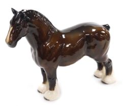 A Beswick brown glass model of a Shire horse, modelled standing, printed mark, 27.5cm high.