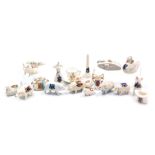 A group of Arcadian and other crested china, including pigs, a sun dial, a lighthouse, WWI tank and