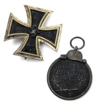 A Third Reich WWII Iron Cross 1939, first class breast badge, the pin marked with the number 65, tog