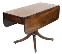 A George III mahogany Pembroke table, with a frieze drawer, raised on a turned column over four outs