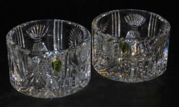 A pair of Waterford Crystal Millennium champagne bottle coasters, 103006, boxed, 13cm diameter.
