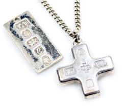 An Elizabeth II silver Millennium cross on a curb link neck chain, together with a silver pendant, S