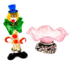 A late 20thC Murano glass figure of a clown, 24cm high, together with a Dettagli pink and white wavy