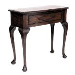 A Victorian oak side table, with a side frieze drawer, raised on cabriole legs, 80cm high, 85cm wide