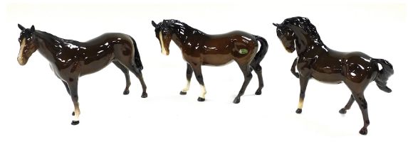 Three Beswick pottery brown gloss horses.