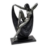 After Alexander Danel, an Art Deco style metal sculpture of a female nude, modelled seated upon a bl