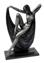 After Alexander Danel, an Art Deco style metal sculpture of a female nude, modelled seated upon a bl