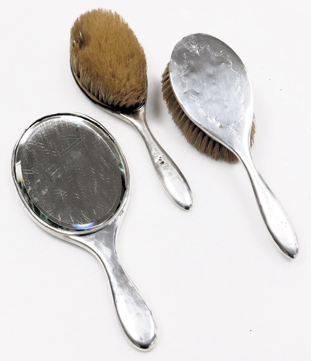 A pair of early 20thC silver backed hairbrushes, with engraved floral and foliate decoration, hallma - Image 2 of 4