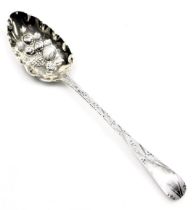 A George III silver Old English pattern serving spoon, later worked as a berry spoon with embossed a
