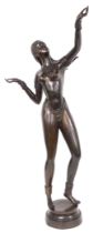 A late 20thC bronze figure of an exotic dancer, adorned with a jewelled necklace and G string, her a