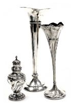 An Edward VII loaded silver bud vase, of trumpet form, Birmingham 1906, 20cm high, further bud vase