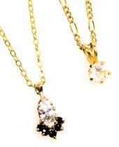 A 9ct gold pendant drop, set with a marquise shaped synthetic diamond and fine tiny sapphires, with