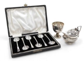 An Elizabeth II silver egg cup and spoon, Sheffield 1957, Edward VII silver mustard pot of semi flut