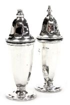 A pair of Elizabeth II silver salt and pepper pots, of octagonal form, Sheffield 1959, 3.30oz.