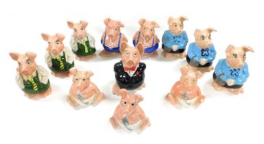 A group of Wade Nat West piggy banks, comprising father, mother (3), son (2), daughter (3) and baby